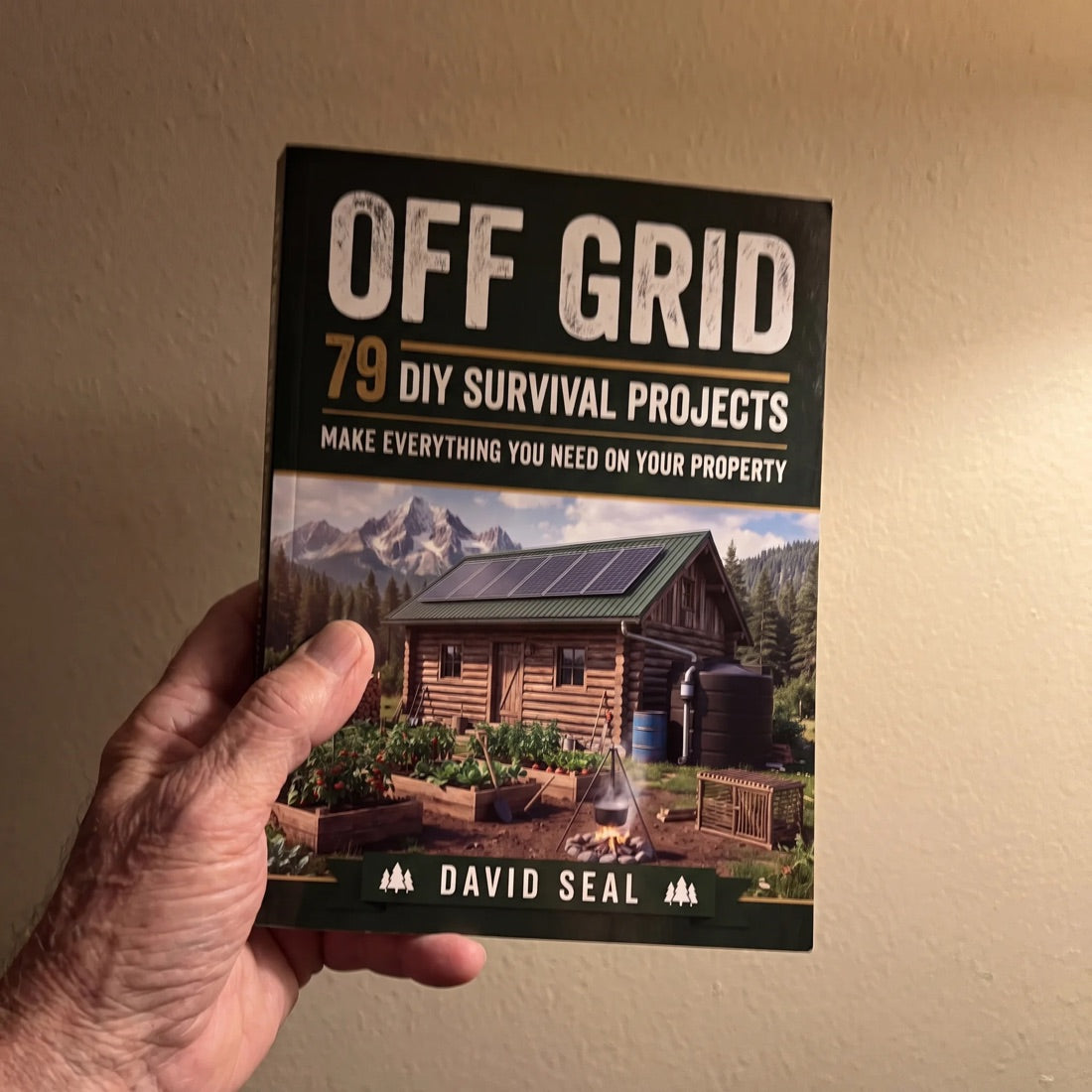 Customer holding the Off Grid book